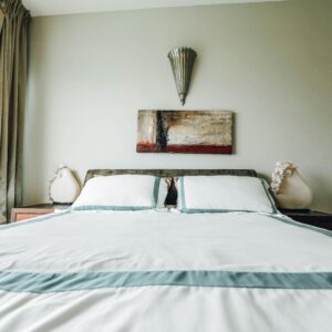 A stylish bedroom featuring contemporary furnishings and minimalist design.