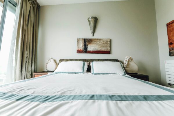 A stylish bedroom featuring contemporary furnishings and minimalist design.
